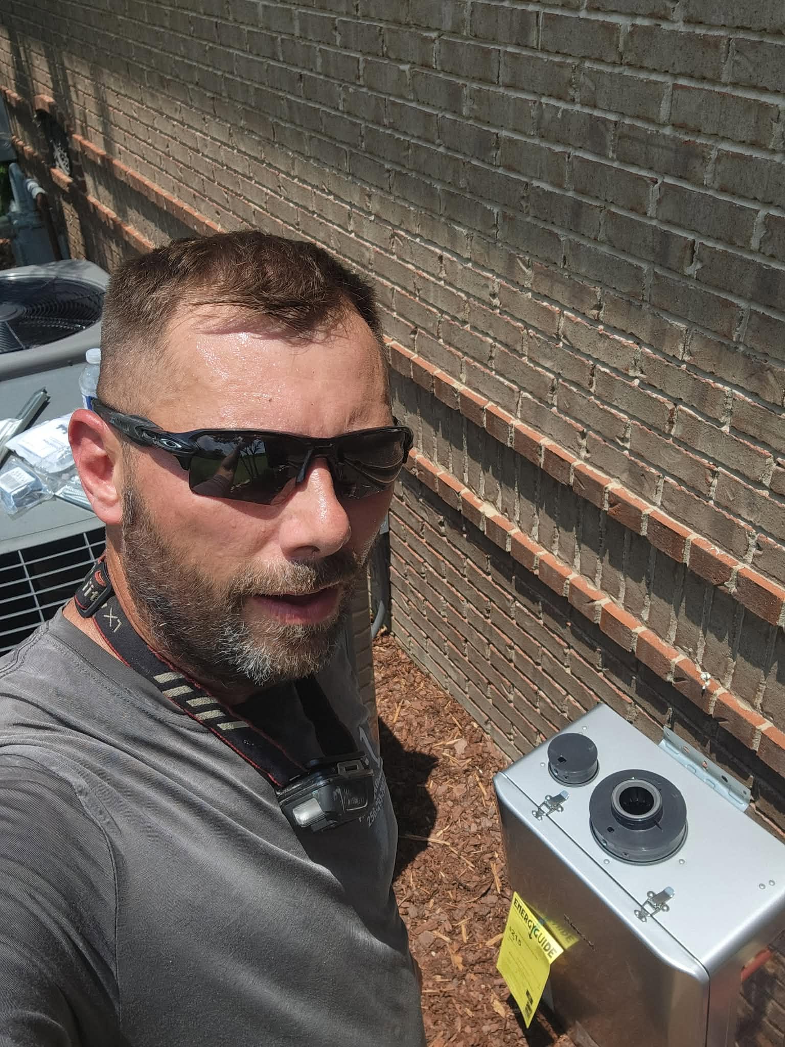 Danny Otwell, veteran-owned owner of Southern Elite Plumbing, installing a water heater