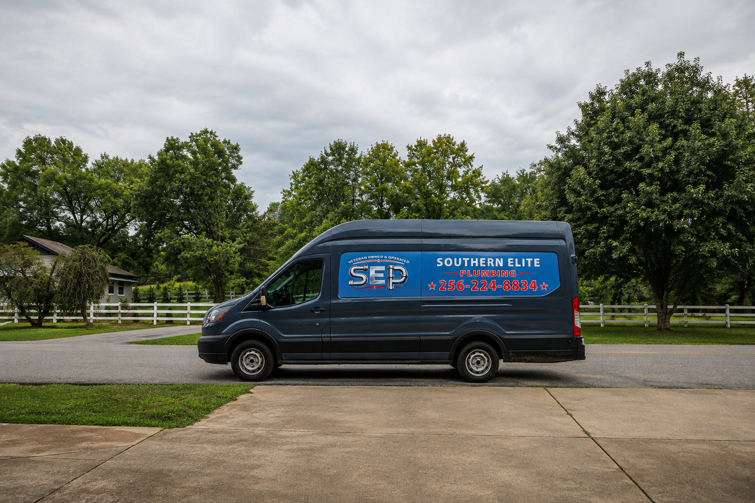 Southern Elite Plumbing service van parked at a residential job site in Alabama